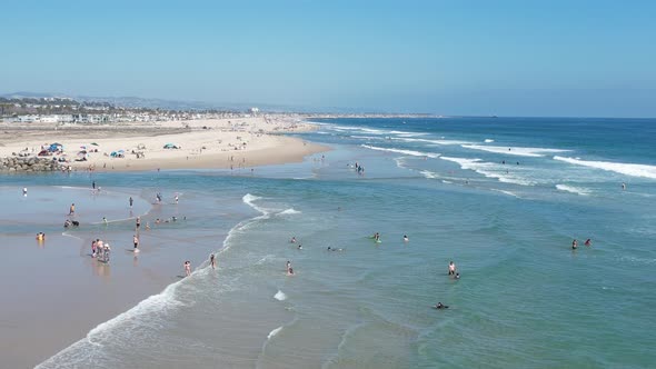 People Enjoy Vacation At The Beach