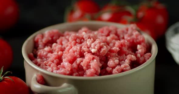 Bowl with Raw Minced Meat Slowly Rotates. 