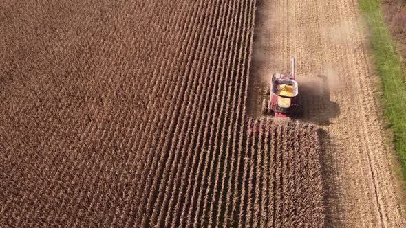 Working Harvesting Combine In The Field Of Corn In Southeast Michigan near Carlton Michigan -aerial