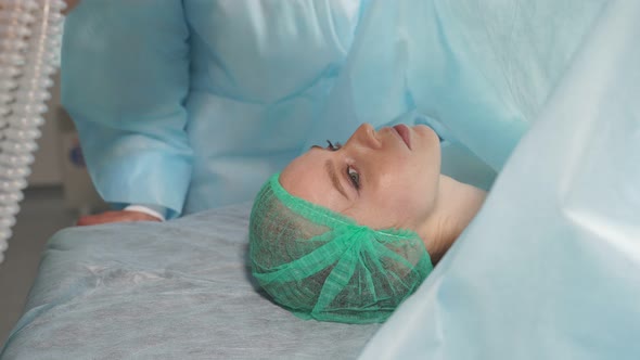 Medical Doctor Giving Anesthesia To Young Girl in Hospital