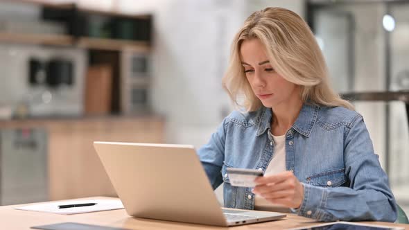 Online Shopping Success on Laptop By Young Woman