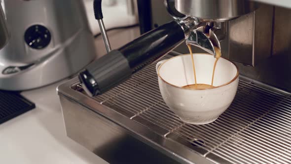 Close Up of Barista Hands Preparing Coffee in Coffee Machine