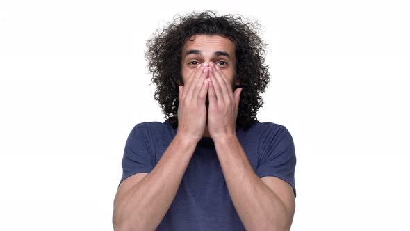 Portrait of Wellbuilt Football Player with Curly Hair in Casual Dark Blue Tshirt Covering Face in