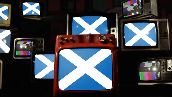 Scotland Flags and Stack of Ancient TVs.