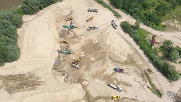 Mining conveyor at sand quarry. Aerial view of mining machinery. Mining industry