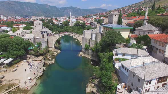 Crowd watching people jumping of the bridge in Mostar