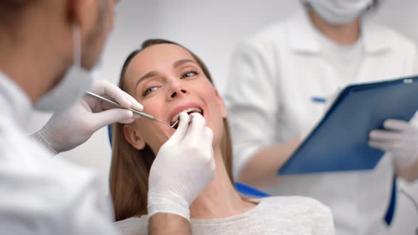 Face Smiling Woman with Open Mouth at Dental Checkup in Stomatology