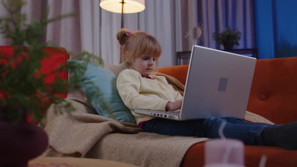 Little School Kid Girl Use Laptop Computer Learning Reading Online Education Lessons Alone at Home