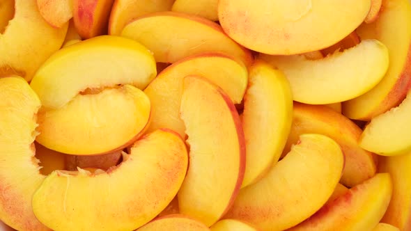 Peach. Sliced peaches close up, rotation. 4K UHD video