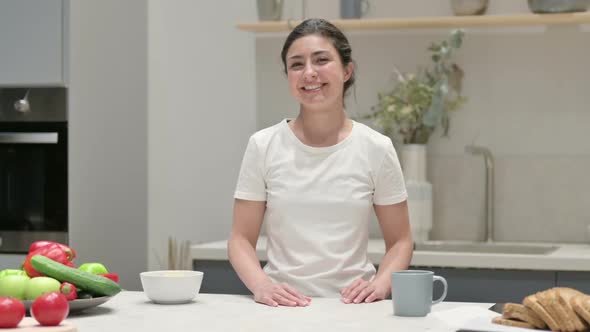 Indian Woman Shaking Head As Yes Sign While in Kitchen