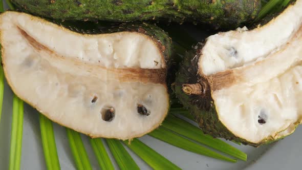 Closeup of Green Soursop Graviola, Exotic, Tropical Fruit Guanabana on Plate