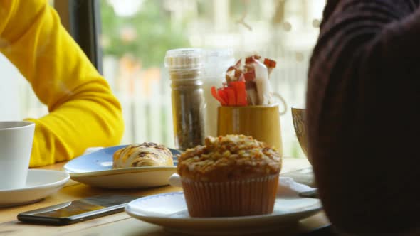 Couple having coffee in cafe 4k