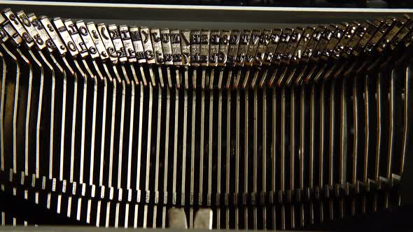 Details of an old retro typewriter, vintage style. Old typewriter hammers. Close up.