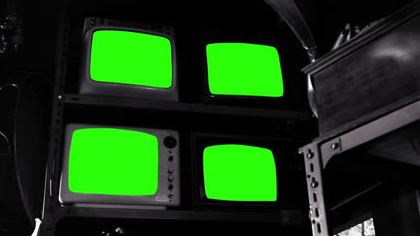 Four Vintage TVs Turning On Chroma Key Green Screens.