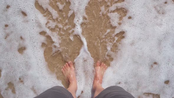 Young traveler and Soft ocean wave on tropical sandy beach in summer