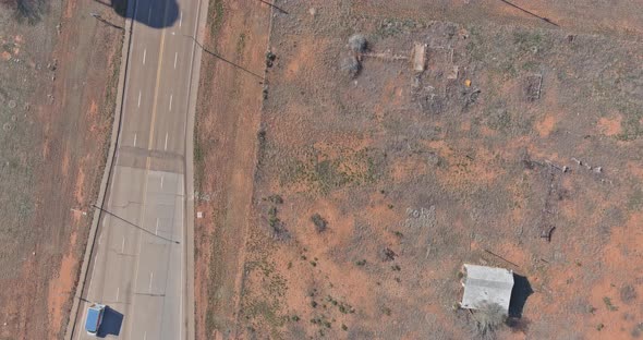 Desert Road Aerial of a New Two Lane Road Surrounded By Desert Landscape Near San Jon New Mexico US