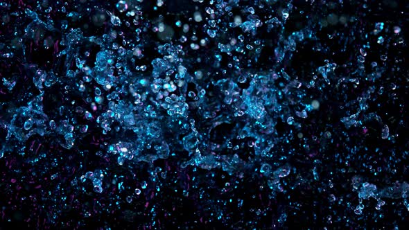 Super Slow Motion Abstract Shot of Splashing Neon Water at 1000Fps.