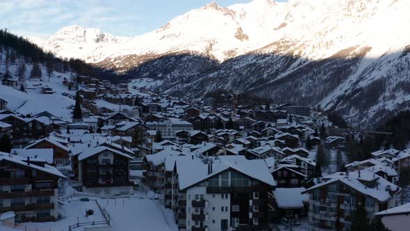 Jib up of idyllic mountain town in winter