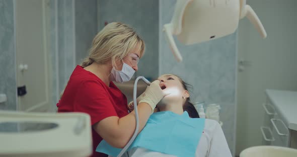 Patient at the Reception at the Dentist in a Modern Clinic