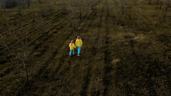 Ukrainian Girls in Clothes in the Colors of the Ukrainian Flag on the Ground