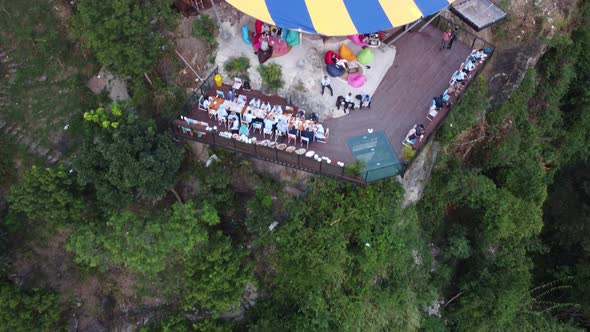 People are eating together at Obelix Hills, one of the favorite tourist destinations in Yogyakarta i