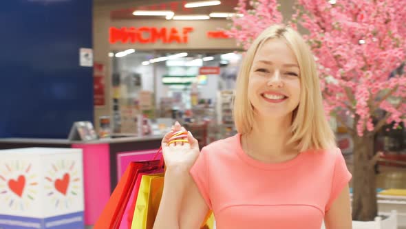 Young Fashionable Woman Went Shopping in a Large Modern Store. Slow Motion