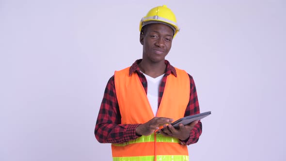 Young Happy African Man Construction Worker Using Digital Tablet