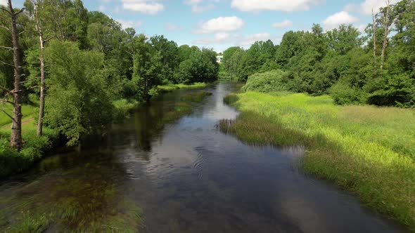 Drone flying against the current river Emån, Sweden