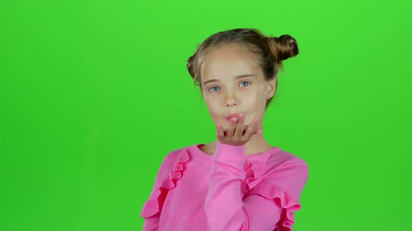 Child Sends an Air Kiss. Green Screen