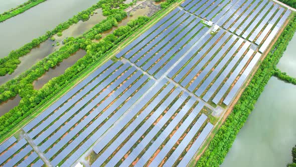 Drone fly over solar farm, renewable energy from solar.