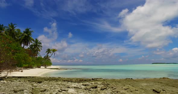 Natural above copy space shot of a paradise sunny white sand beach and blue water background in colourful