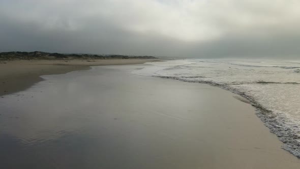 Drone Flying Backwards Alone Shoreline