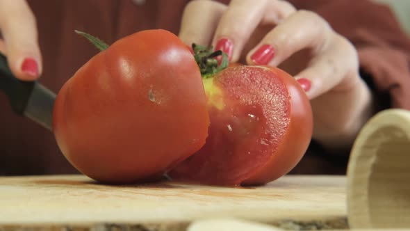 Closeup Cutting Red Tomato