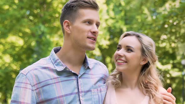 Young Happy Couple Walking in City Park, Enjoying Romantic Date Outside, Love