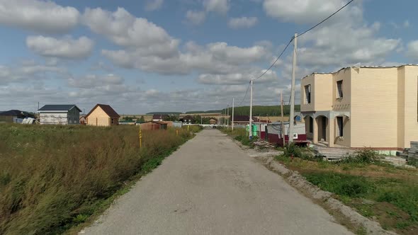 Drone view of Dirt road in the cottage village 32