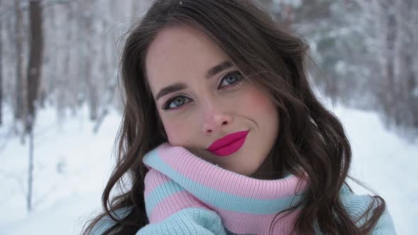 Beautiful Woman in Snowy Countryside