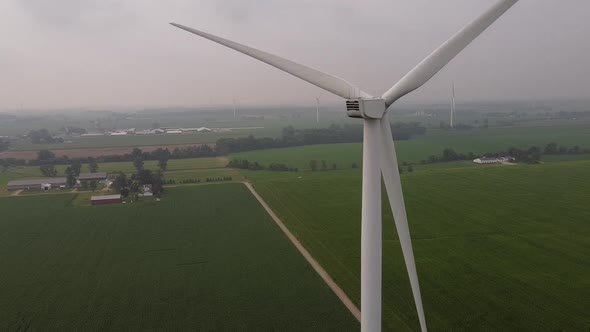 Windmill Turning At DTE Wind Farm With A View Of Vast Green Meadow In Ithaca, Gratiot County, Michig