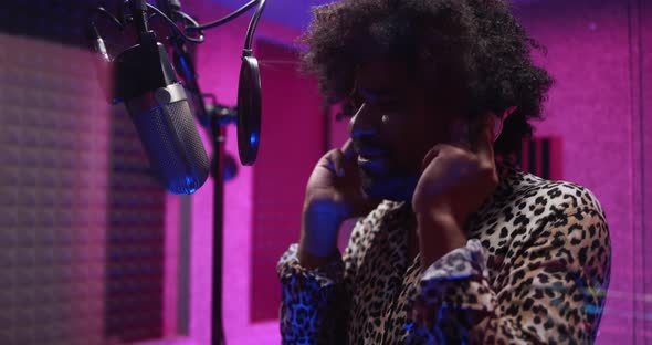 African american singer recording new music album inside boutique studio
