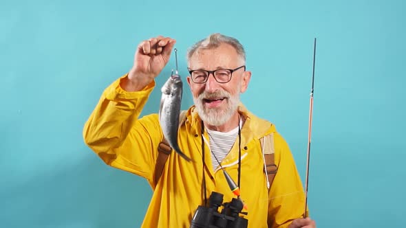 Smiling Funny Old Fisherman Has Caught Fish for His Wife, Family