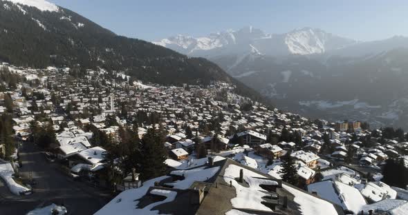 Aerial Shot of a Village in Switzerland That Was Covered in Snow at a Popular Destination for Skiers