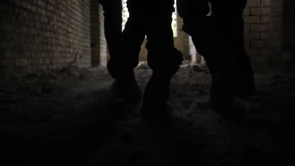 Soldiers Dragging Wounded Warrior From Battlefield alt