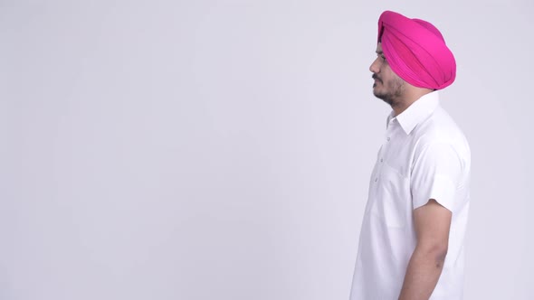 Profile View of Bearded Indian Sikh Man Thinking While Wearing Turban