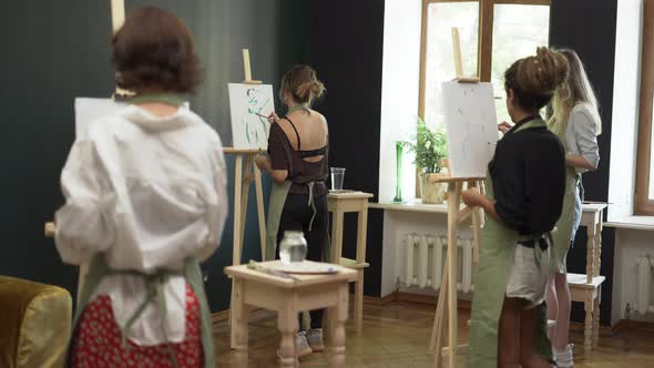 Group of Students Painting at Art Lesson in Studio in Slowmo