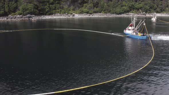 Fishing Trawler Haul Net On Sea With Caught Fish In Alaska. - aerial