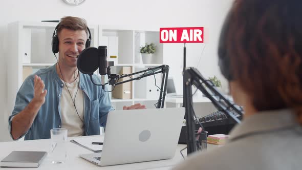 Joyful Interview in Broadcast Studio