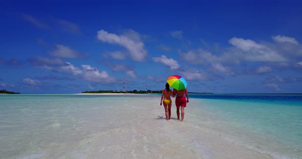 Romantic people in love dating on vacation enjoy life on beach on clean white sand background