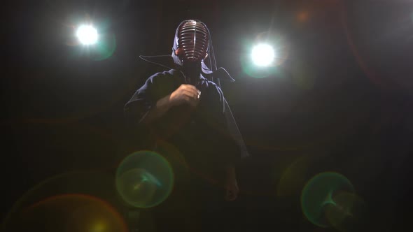 Athletic Kendo Instructor Is Posing for the Camera in Twilight