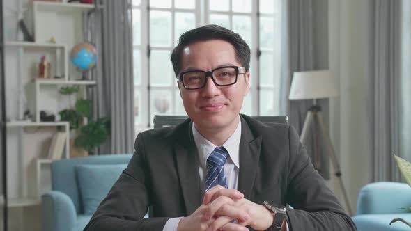 Asian Businessman Talking On The Video Call While Working At Home