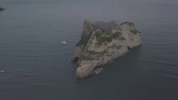 Rocky islet with tunnel