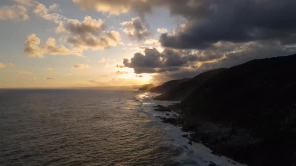 Aerial view of Otter Trail seaside cliffs at sunset, Eastern Cape, South Africa.